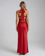 Celeste Maxi Dress by Lauven featuring a stunning red satin back with a bow detail and trendy cut-out design.