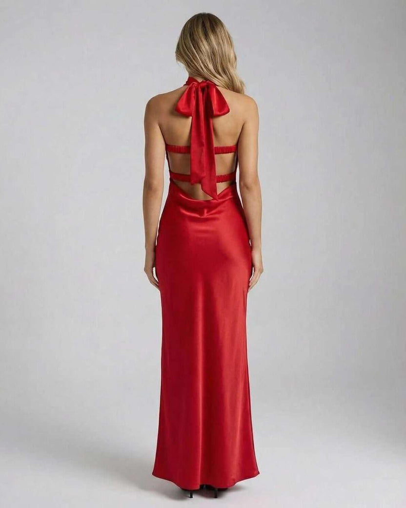 Celeste Maxi Dress by Lauven featuring a stunning red satin back with a bow detail and trendy cut-out design.