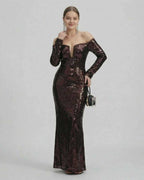 Elegant model in a Celeste Maxi Dress by Lauven showcasing a sequined off-shoulder neckline and fitted silhouette.