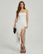 Celeste Maxi Dress by Lauven, elegant strapless white dress with ruffle details and high slit.