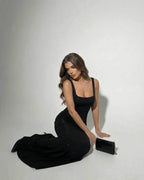 Celeste Maxi Dress by Lauven in sleek black stretch satin, showcasing elegance and subtle sparkle.