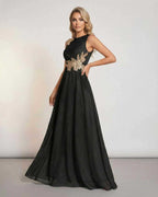 Celeste Maxi Dress by Lauven, featuring a sleeveless black design with elegant patchwork detail and flowing silhouette.