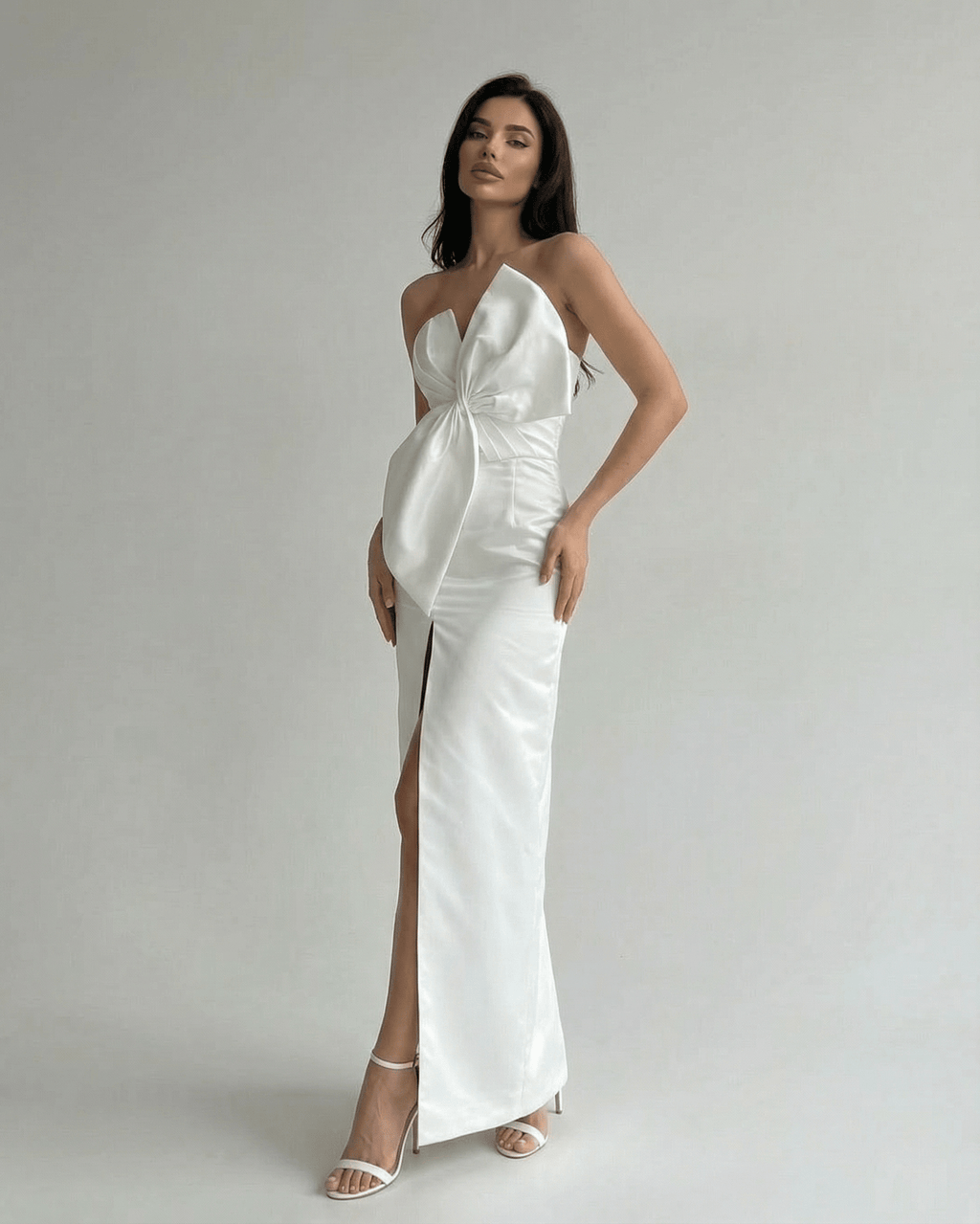 Celeste Maxi Dress by Lauven featuring a white satin strapless design with a front slit and elegant sheath silhouette.