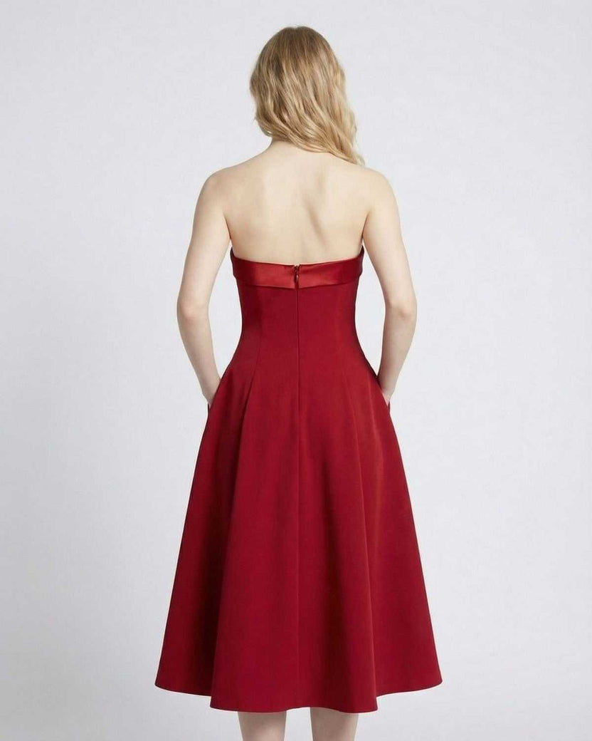 Celeste Midi Dress by Lauven — Back view of strapless high-waist midi dress in red with pockets.