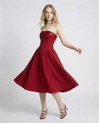 Celeste Midi Dress by Lauven, strapless high-waist midi silhouette in elegant red with flattering pockets.