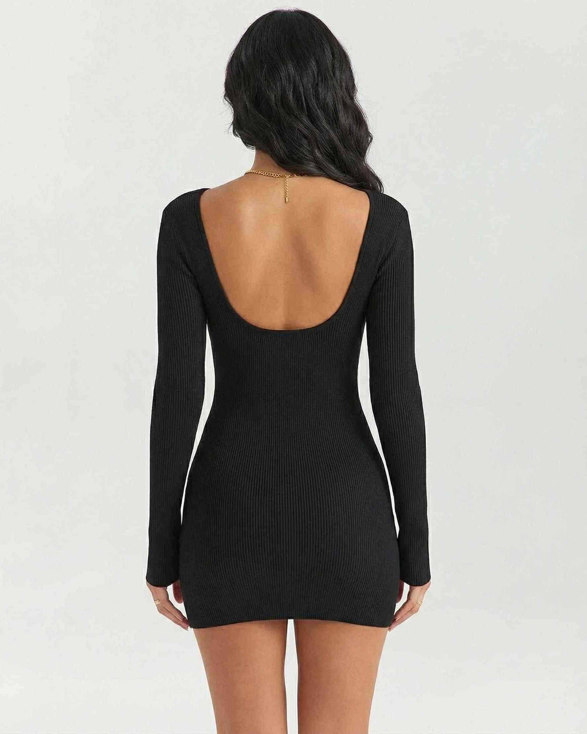 Back view of women’s Celeste Mini Dress by Lauven, featuring a ribbed texture and long sleeves in elegant black.