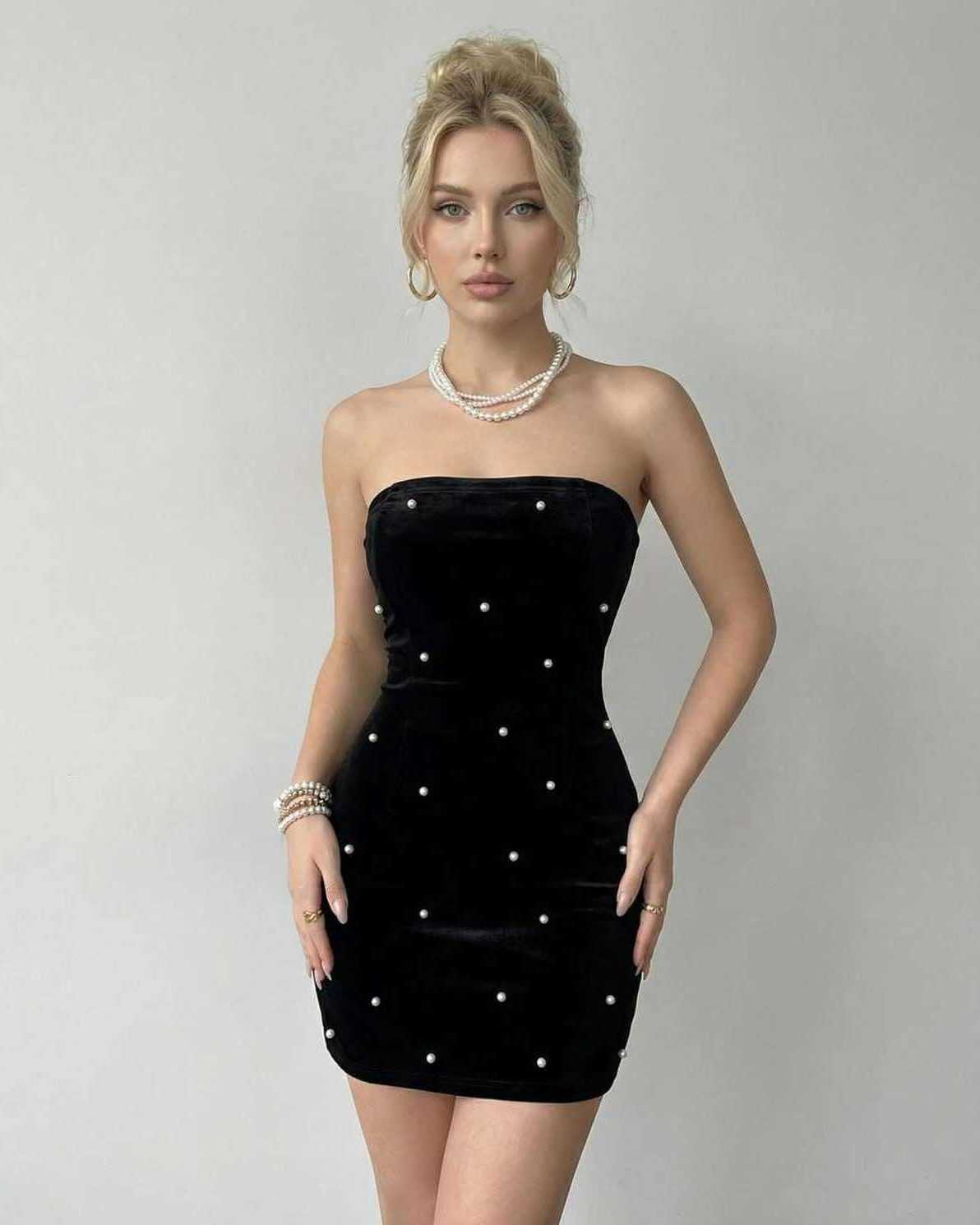 Celeste Mini Dress by Lauven - Strapless black velvet with pearl accents, showcasing a flattering bodycon silhouette.