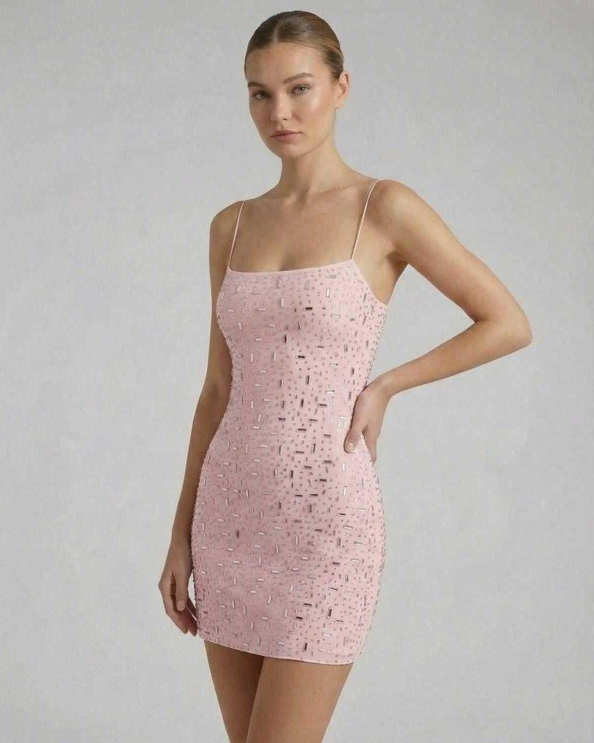 Celeste Mini Dress by Lauven, a pink mini dress with rhinestone embellishments and thin spaghetti straps.
