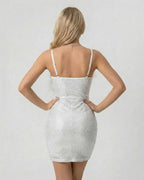 Back view of the Celeste Mini Dress by Lauven, featuring shimmering sequins and faux fur detailing.