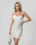Celeste Mini Dress by Lauven, featuring a sequin bodycon style and faux fur detail, perfect for modern glamour.