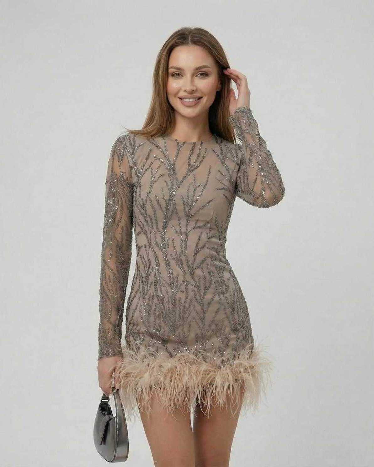 Lauven Celeste Mini Dress featuring sequin embellishments and feather trim, perfect for a luxurious look.