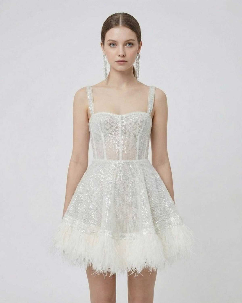 Celeste Mini Dress by Lauven, silver sequin A-line mini dress with faux fur hem and spaghetti straps.