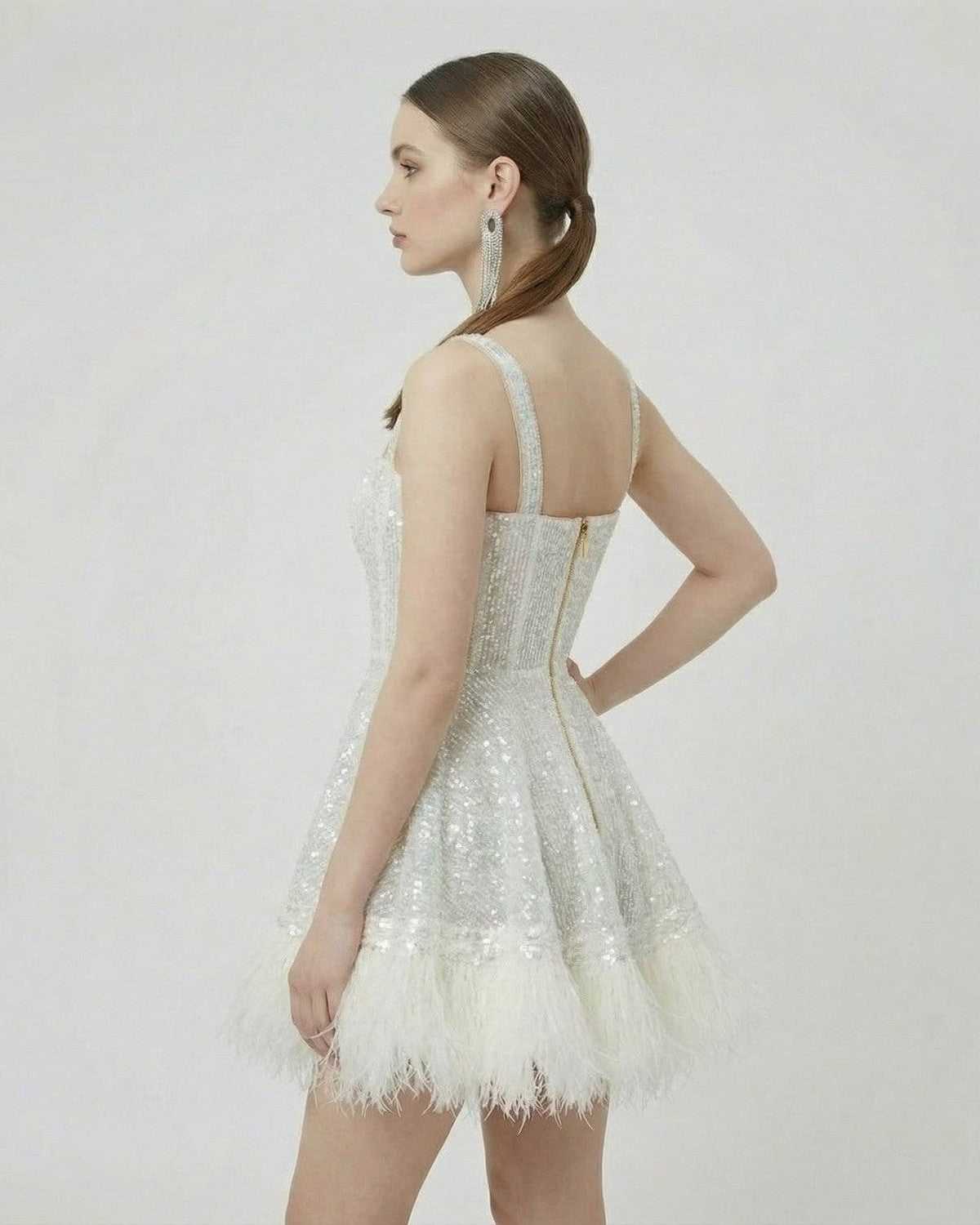 Celeste Mini Dress by Lauven, featuring silver sequins and faux fur hem in A-line silhouette.
