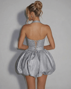 Celeste Mini Dress by Lauven, silver sequin pouf silhouette showcasing a stylish back design. Perfect for any special occasion.