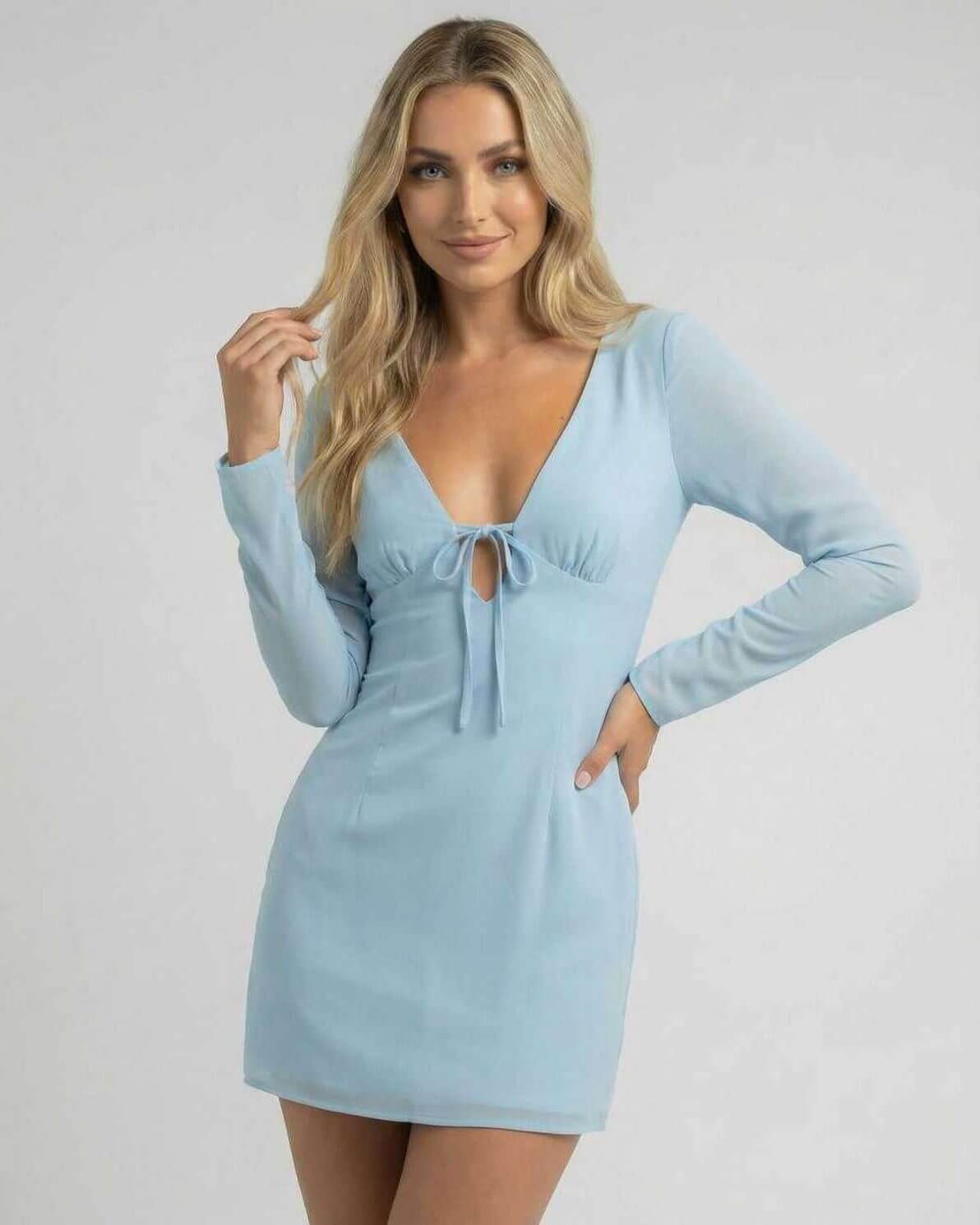 Celeste Mini Dress by Lauven in soft blue featuring a v-neckline and sleek silhouette with long sheer sleeves.