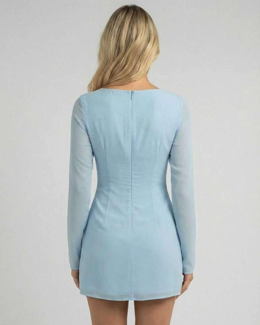 Celeste Mini Dress by Lauven in soft blue, showcasing a sleek silhouette and elegant long sleeves from the back.