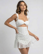 Celeste Mini Dress by Lauven in white lace with spaghetti straps and slim fit aesthetic.