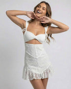 Celeste Mini Dress by Lauven in white lace, featuring spaghetti straps, V-neckline, and flared hem.