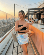 Celeste Mini Skirt by Lauven, blue iridescent sequin bodycon mini skirt, perfect for parties and evening events.