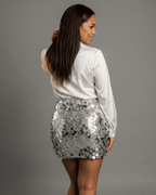 Celeste Mini Skirt by Lauven - Upscale sequin bodycon mini skirt showcased from the back view.
