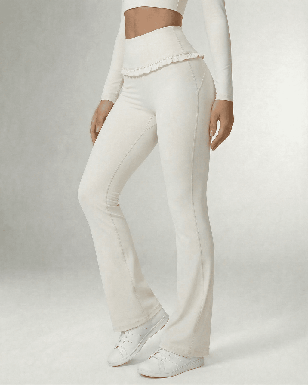 Celeste Leggings by Lauven, elegant white flare pants with pockets and ruffle detail.