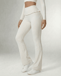 Celeste Leggings by Lauven, elegant white flare pants with pockets and ruffle detail.