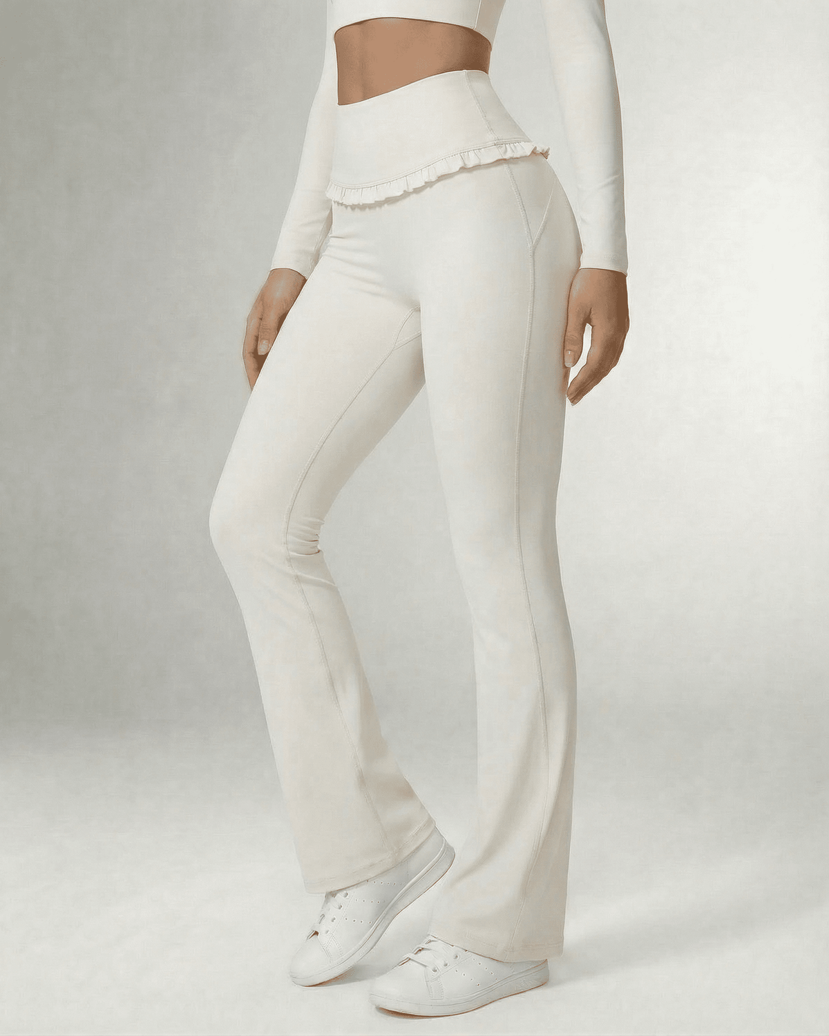 Celeste Leggings by Lauven, elegant white flare pants with pockets and ruffle detail.