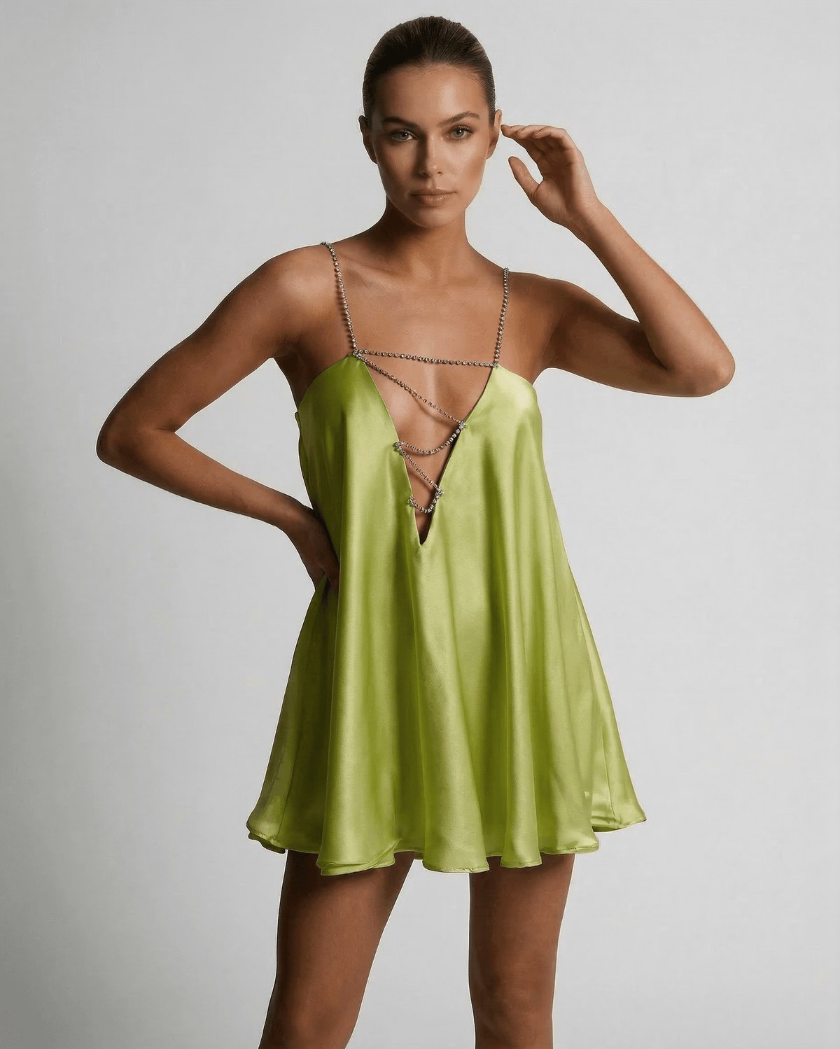 Model wearing a Chartreuse Mini Dress by Lauven, showcasing a sleek A-line silhouette with a V-neckline.