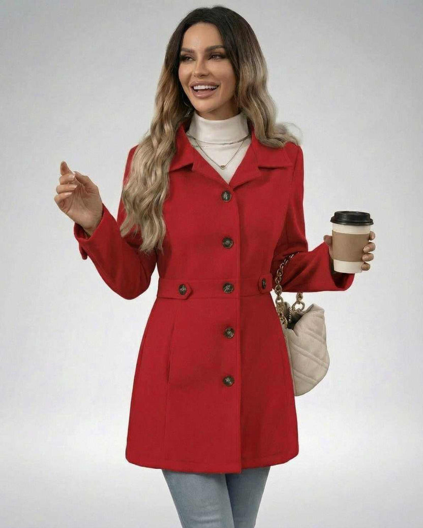 Woman wearing a Crimson Sculpt Jacket by Lauven, showcasing a stylish and tailored look with a coffee cup.