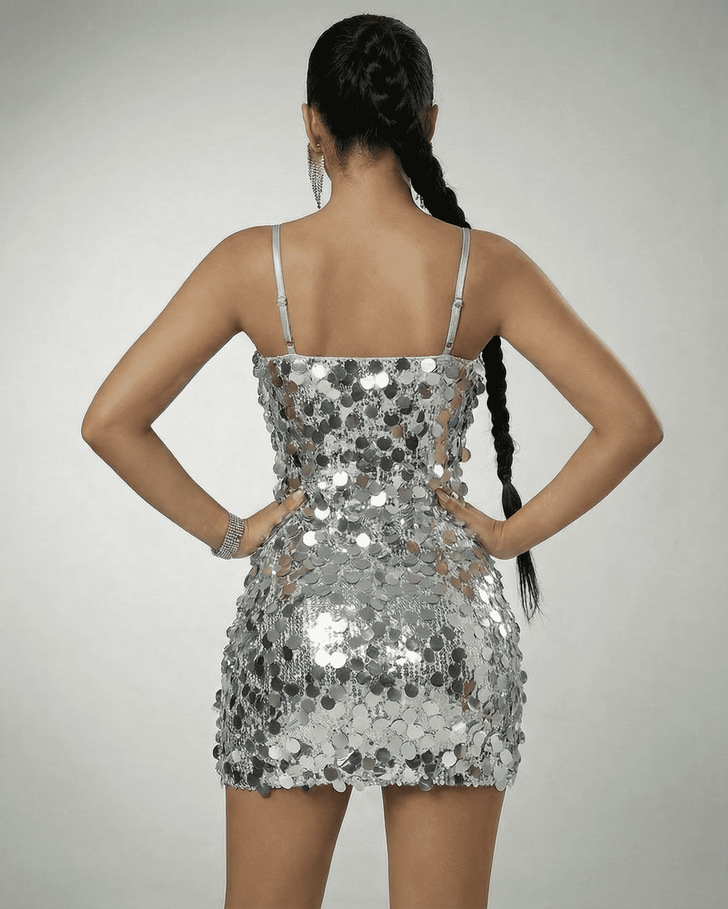 Eestella Mini Dress by Lauven, silver sequin off-the-shoulder dress showcasing a high-waist silhouette from the back.