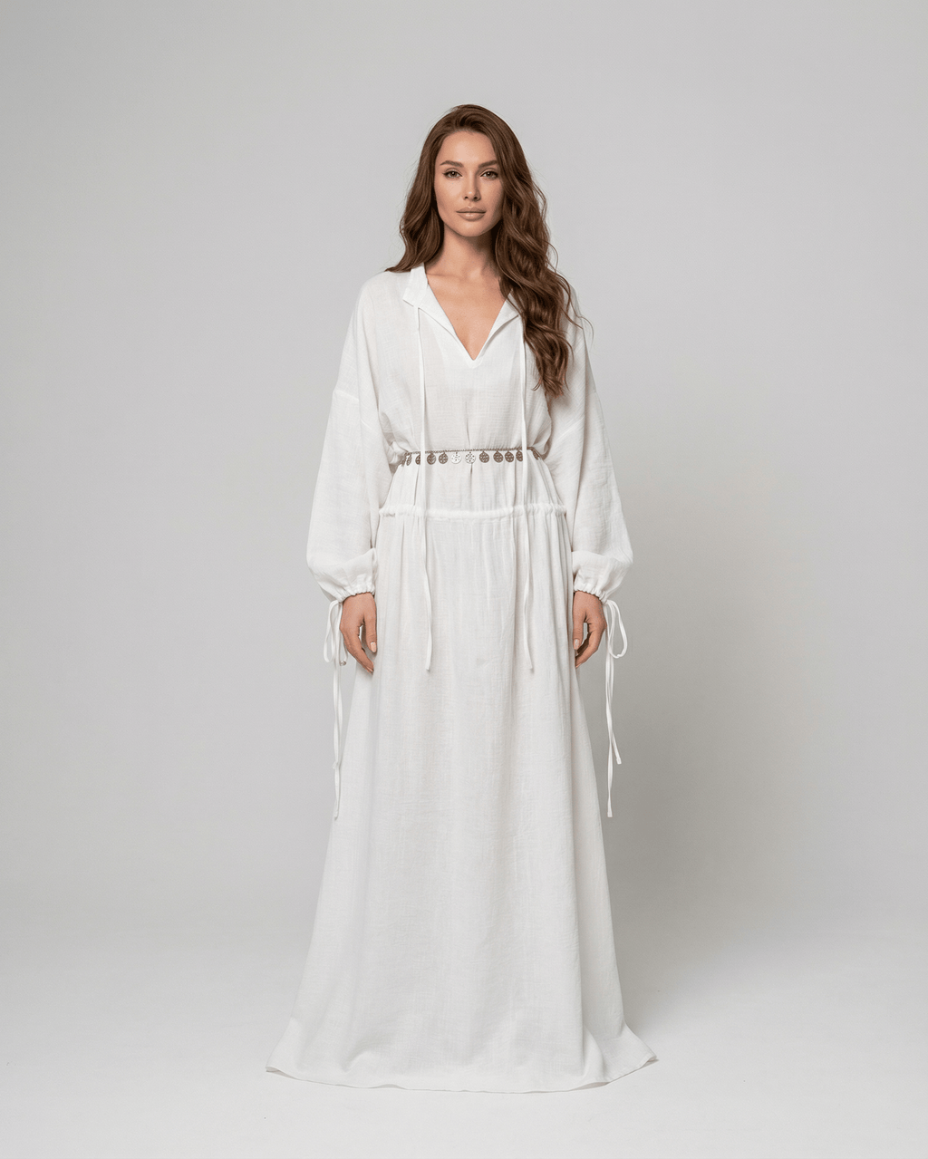 Elara Maxi Dress by Lauven, a cotton A-Line maxi dress with adjustable waist and long sleeves in white.