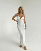 Elara Maxi Dress by Lauven, featuring a lace V-neck halter design and fitted sheath silhouette in white.