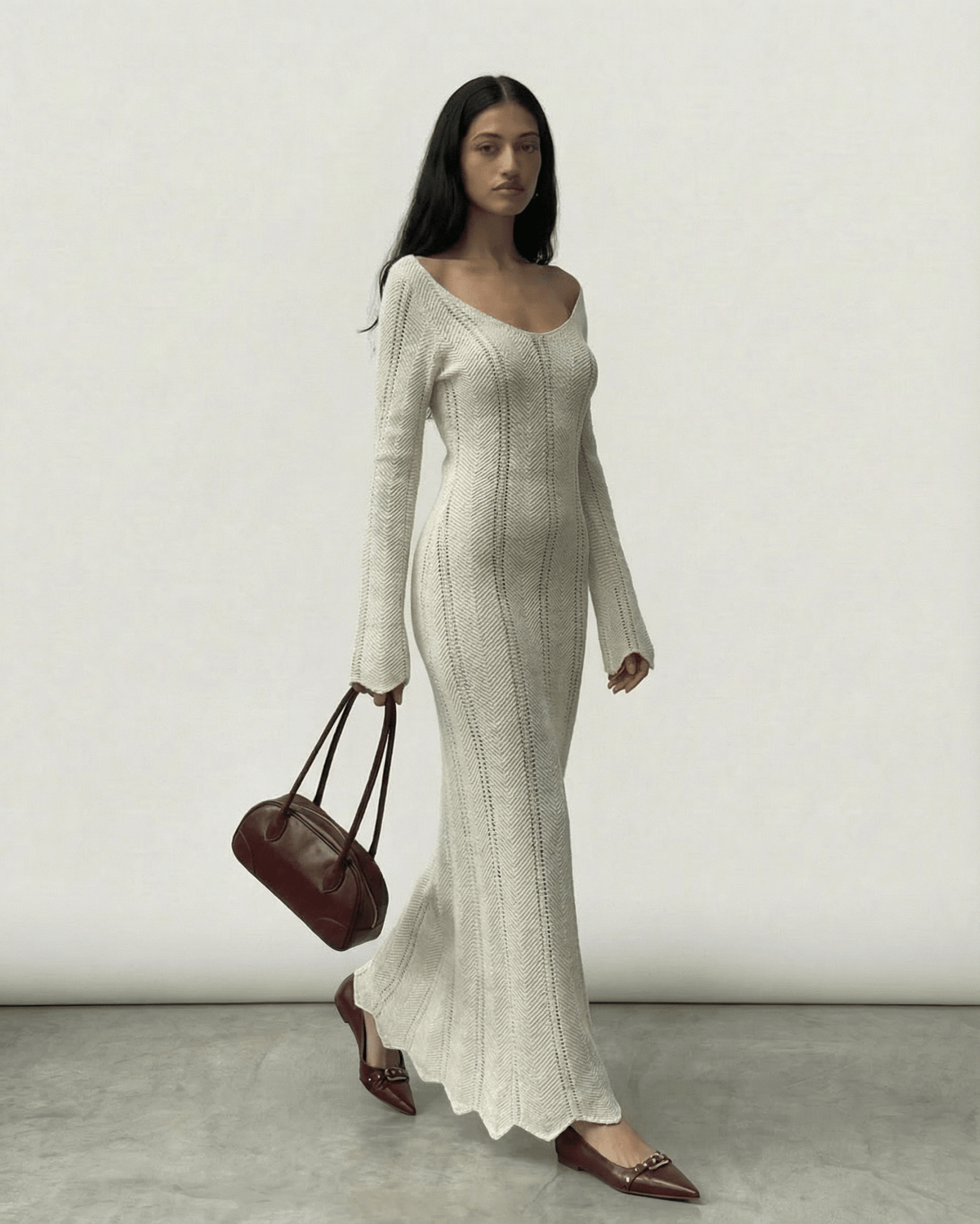 Model wearing Elara Maxi Dress by Lauven, featuring a ribbed design and flowing silhouette.