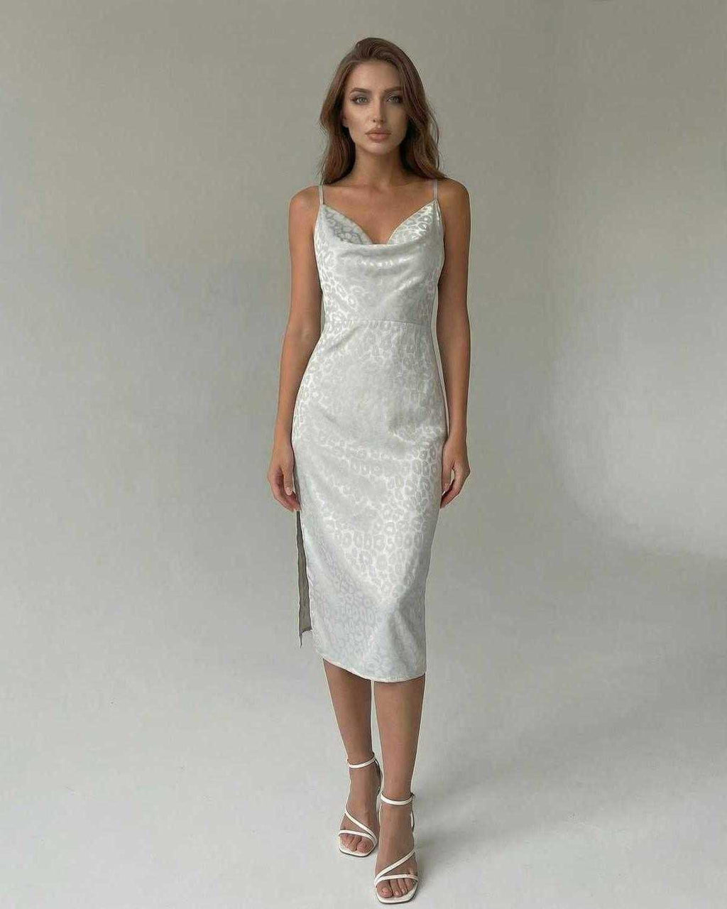 Elara Midi Dress by Lauven, elegant satin-effect spaghetti strap split midi dress showcased on model.