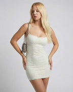 Elara Mini Dress by Lauven, showcasing a sleek ivory lace bodycon slip silhouette for modern elegance.