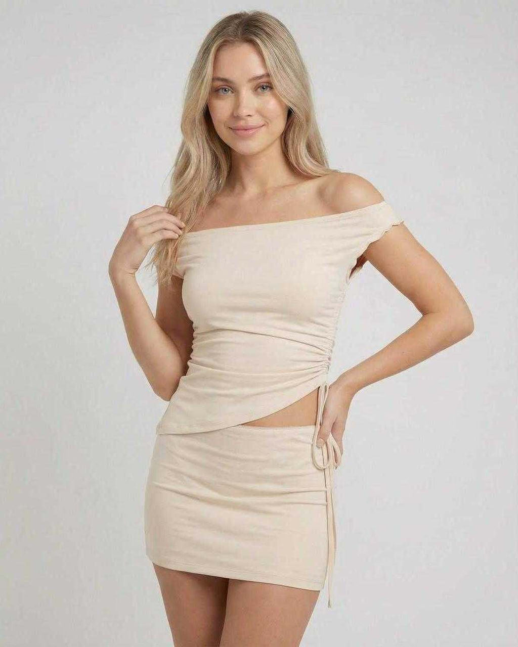 Elysia Mini Dress by Lauven featuring asymmetric off-shoulder top and high waist mini skirt in a neutral tone.