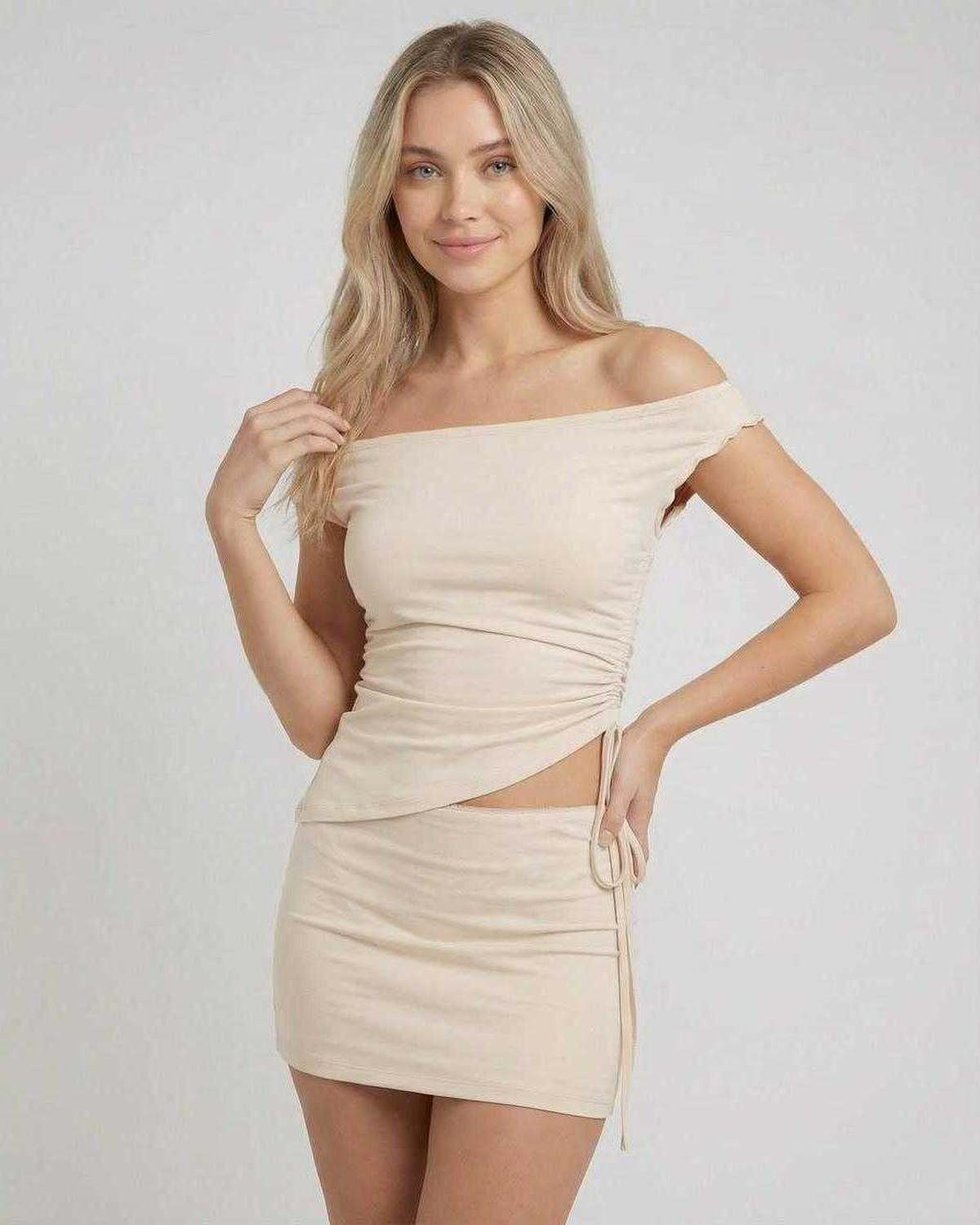 Elysia Mini Dress by Lauven featuring asymmetric off-shoulder top and high waist mini skirt in a neutral tone.