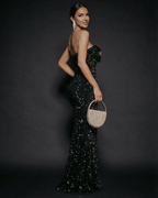 Lauven Emerald Maxi Dress, strapless sequin party dress with a bow, showcasing elegance and glamour.