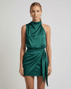 Emerald Mini Dress by Lauven – Dark green satin dress with high neck and wrap tie detail.