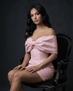 Fiora Mini Dress by Lauven showcases a stunning off-the-shoulder neckline with a bowknot detail in soft pink.