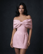 Fiora Mini Dress by Lauven featuring a bowknot off-the-shoulder design in a soft pink hue.