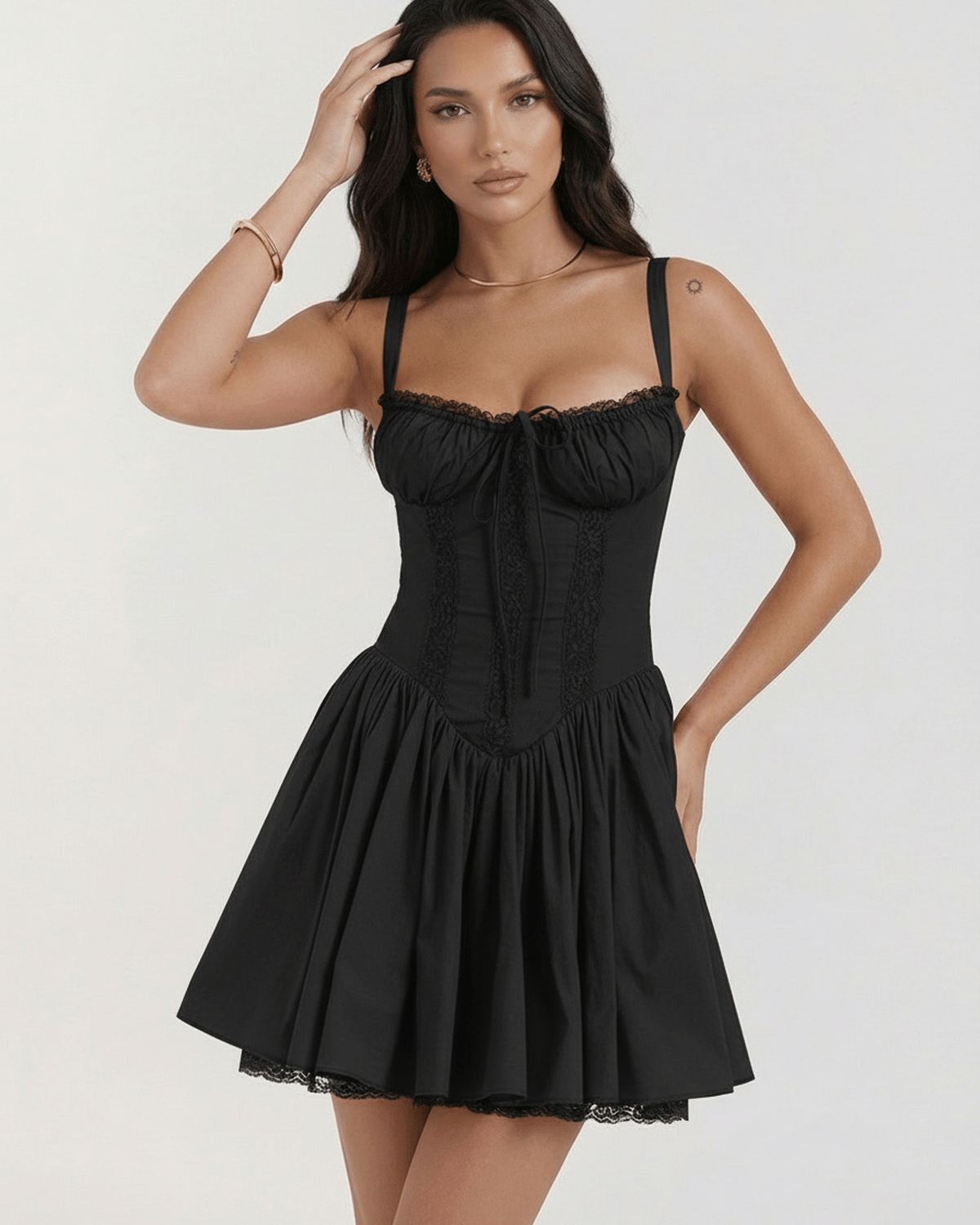 Aurora Mini Dress by Lauven, showcasing a flirty black strapless lace design with adjustable spaghetti straps.