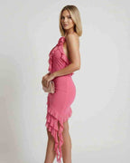 Woman wearing Lauven Flora Mini Dress in soft pink polyester with ruffle detail, showcasing a chic summer look.