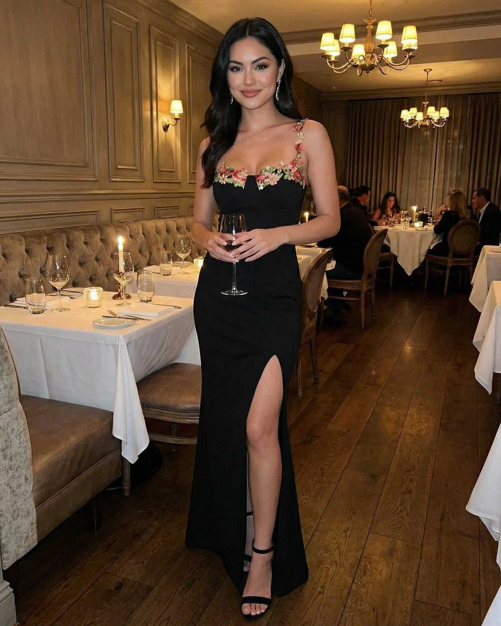 Florence Maxi Dress by Lauven — Embroidered black dress with elegant slit in a sophisticated dining setting.