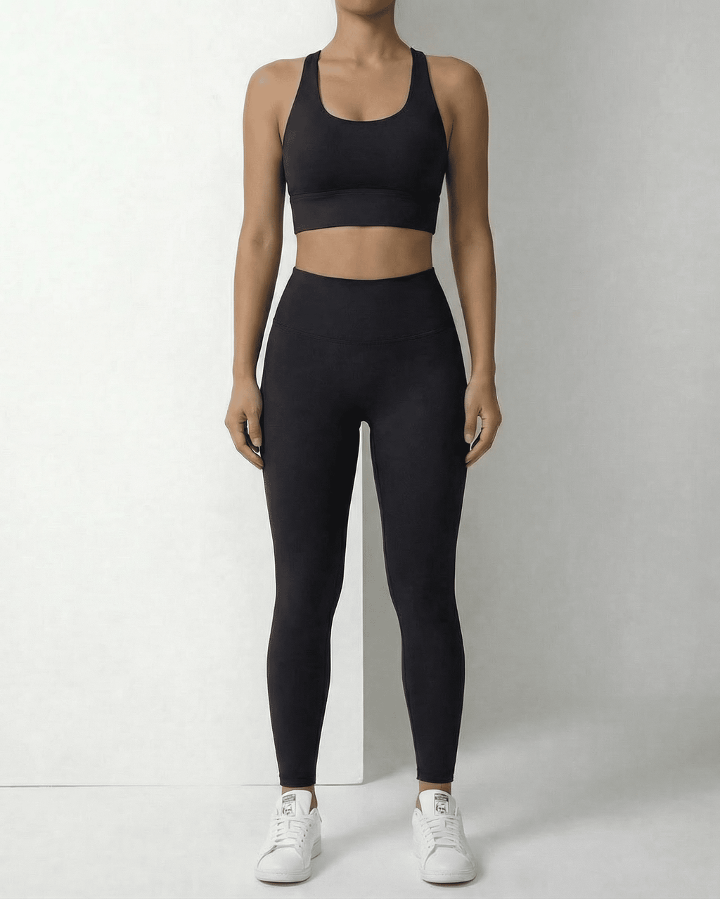 Iris Leggings Black by Lauven - Sleek black ankle-length leggings with pockets, designed for comfort and style.