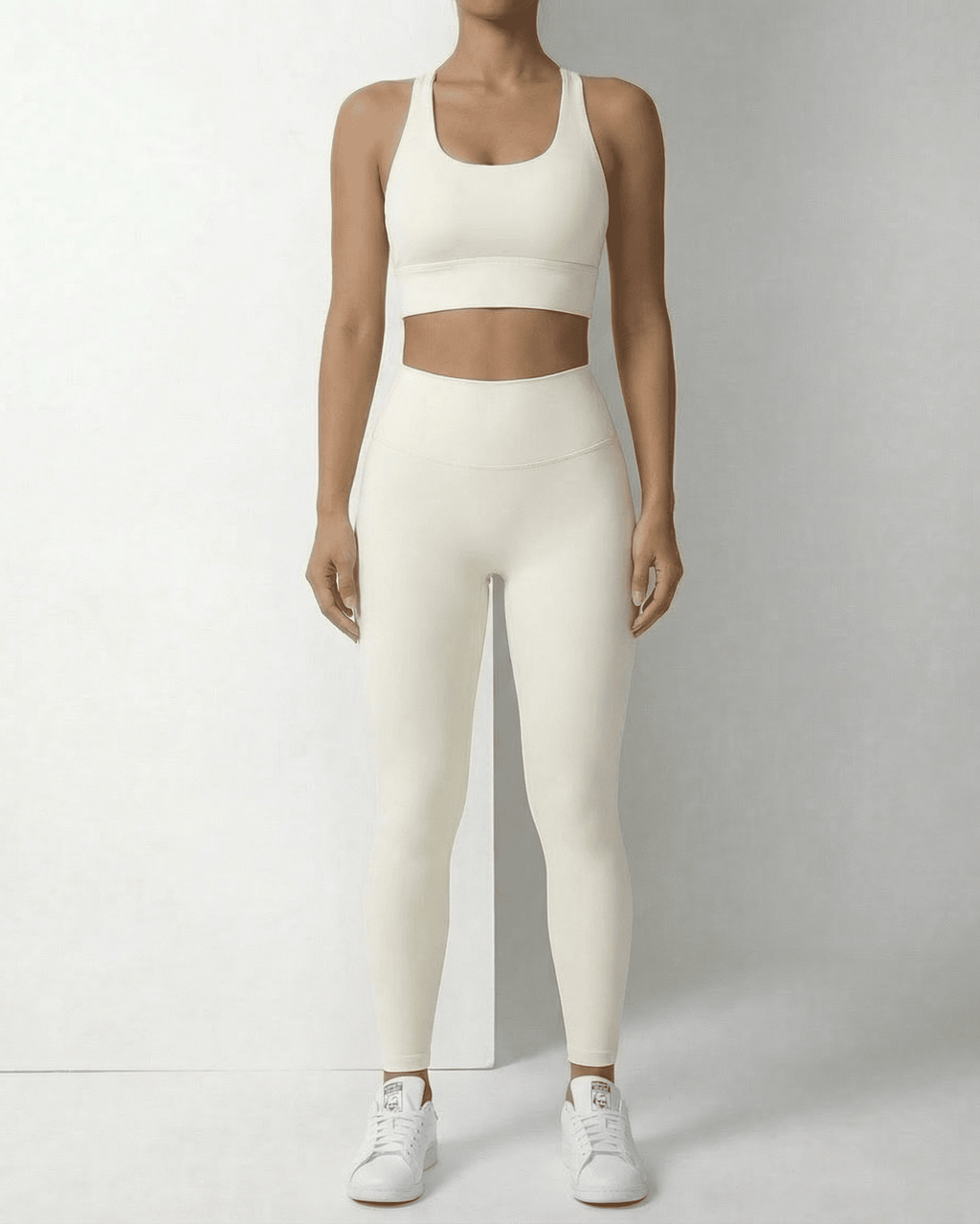 Iris Leggings Cream by Lauven, sleek ankle-length leggings with pockets, featuring a high waistband and a smooth fit.