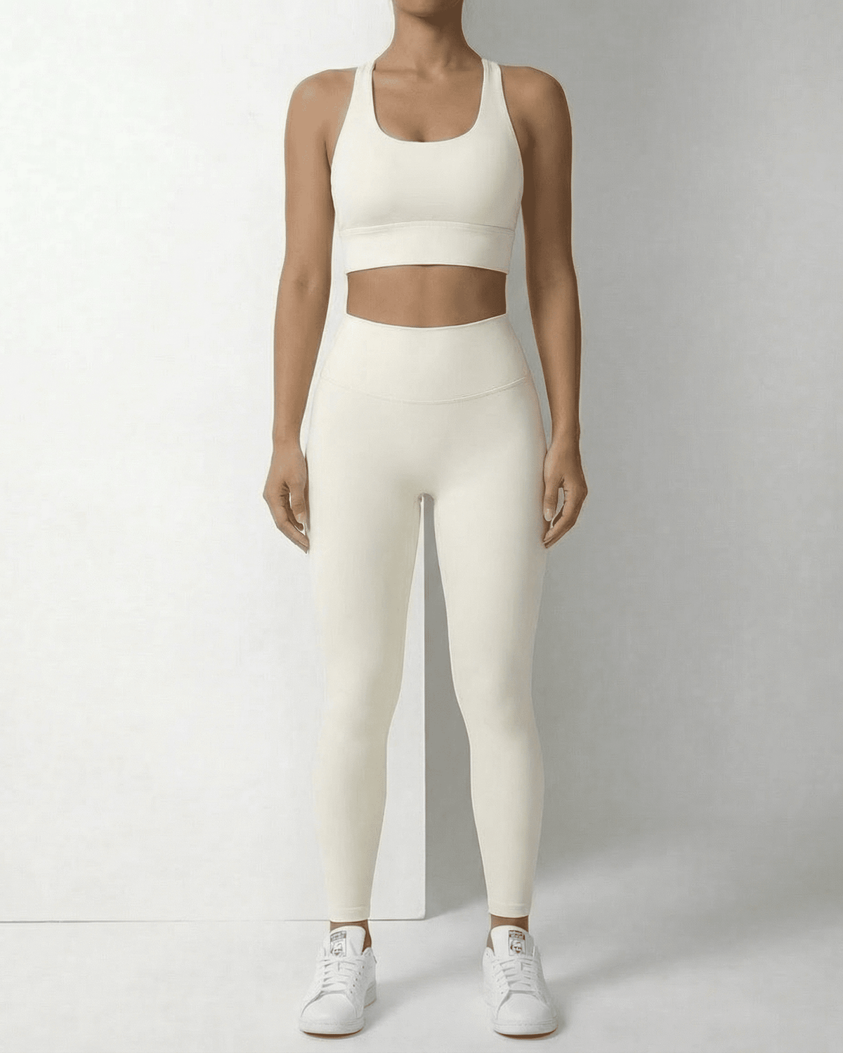 Iris Leggings Cream by Lauven, sleek ankle-length leggings with pockets, featuring a high waistband and a smooth fit.