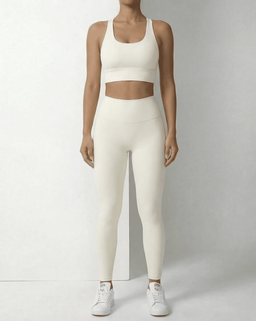 Iris Leggings Cream by Lauven, sleek ankle-length leggings with pockets, featuring a high waistband and a smooth fit.