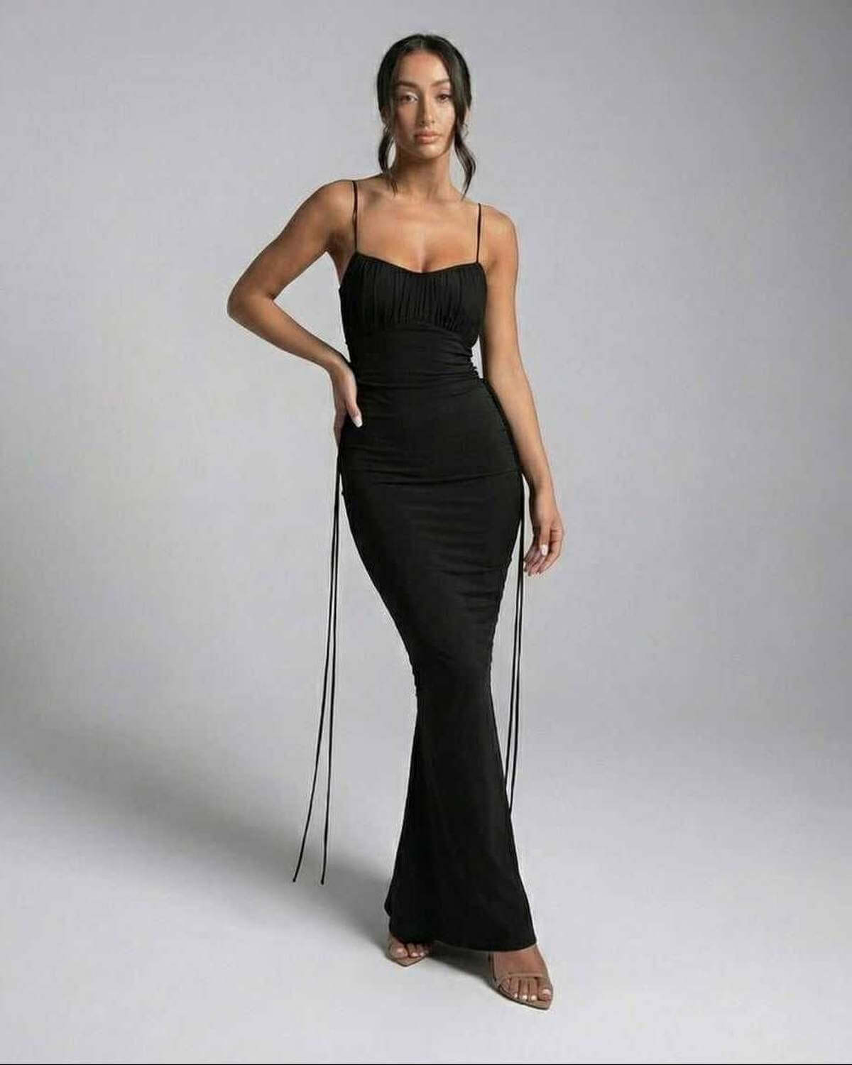 Lauven Isla Maxi Dress - Black Sleeveless Spaghetti Strap Sheath Dress on model, showcasing elegant silhouette.
