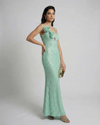 Isla Maxi Dress by Lauven in mint green sequins, featuring floral detail and spaghetti straps, perfect for spring occasions.